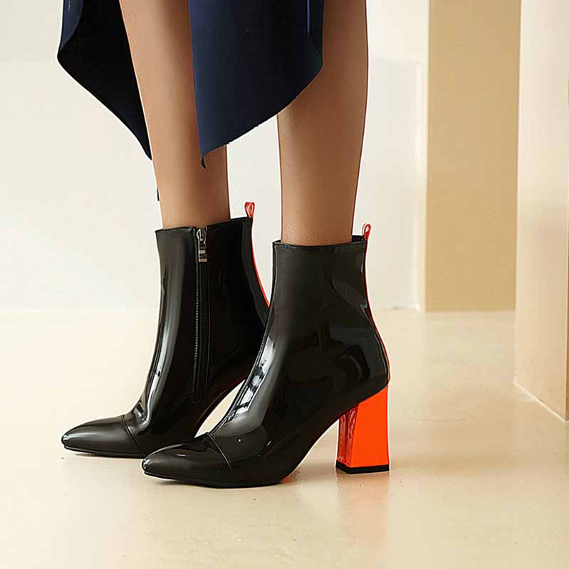 Black women's block heel ankle boots with shiny finish and bold orange block heel