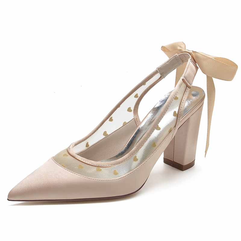 Elegant women's block heel wedding shoes with clear panels and bow detail for a stylish bridal look