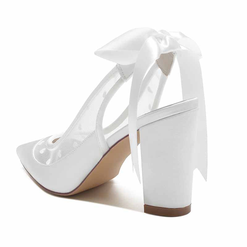 Elegant women's block heel wedding shoes with bow detail and clear strap for a stylish bridal look