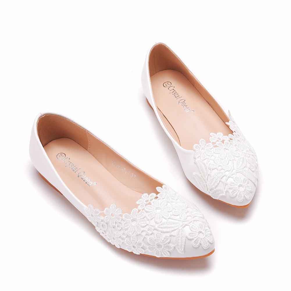 Elegant women’s bridal flats in white with detailed floral lace design