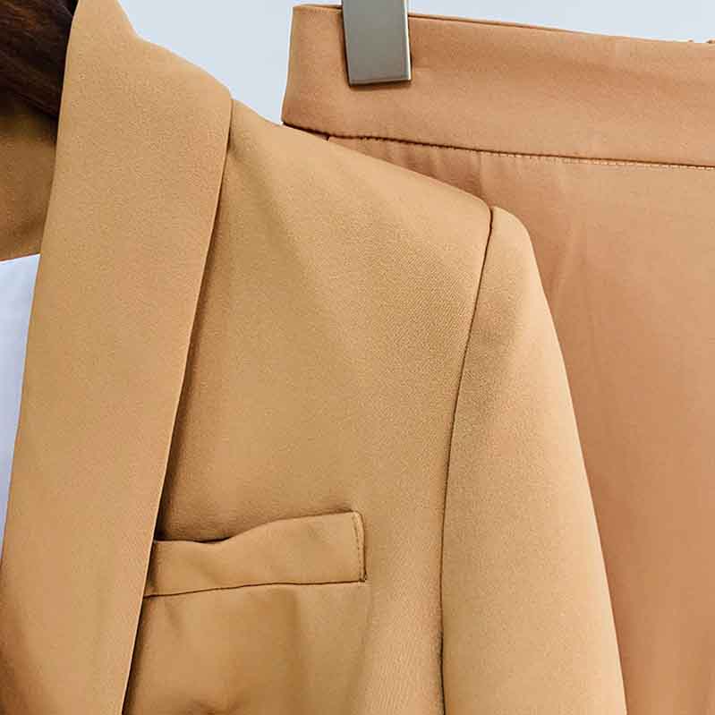 Stylish women's camel pantsuit for work featuring a tailored blazer and matching trousers