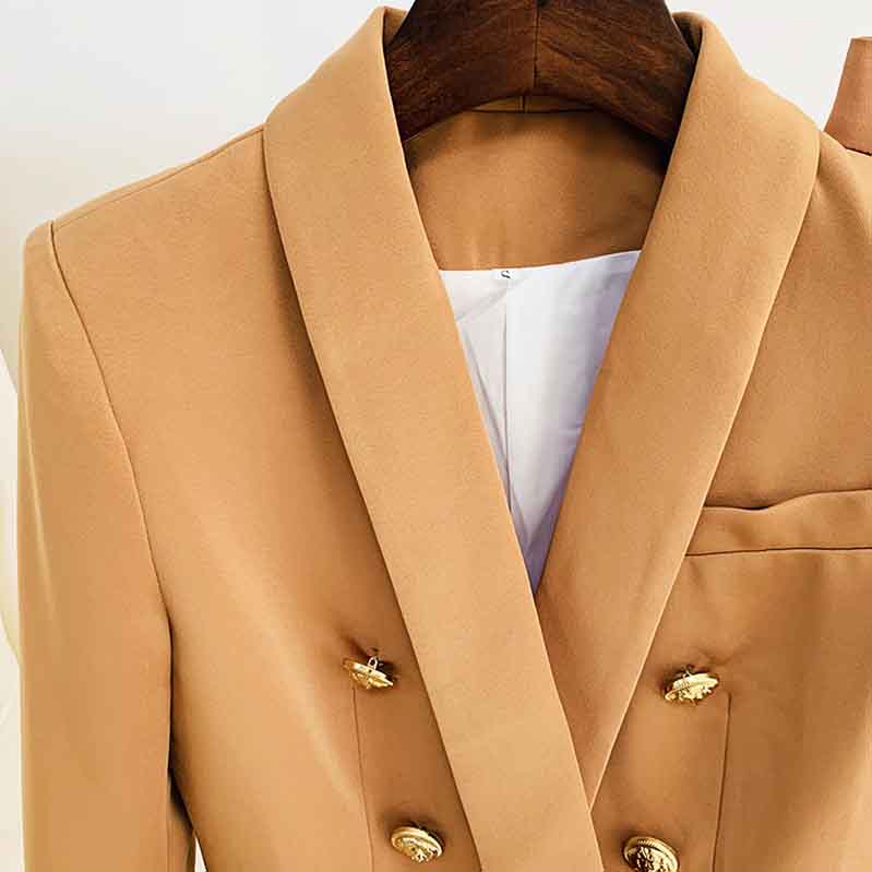 Stylish women's camel pantsuit for work featuring a tailored blazer with gold buttons