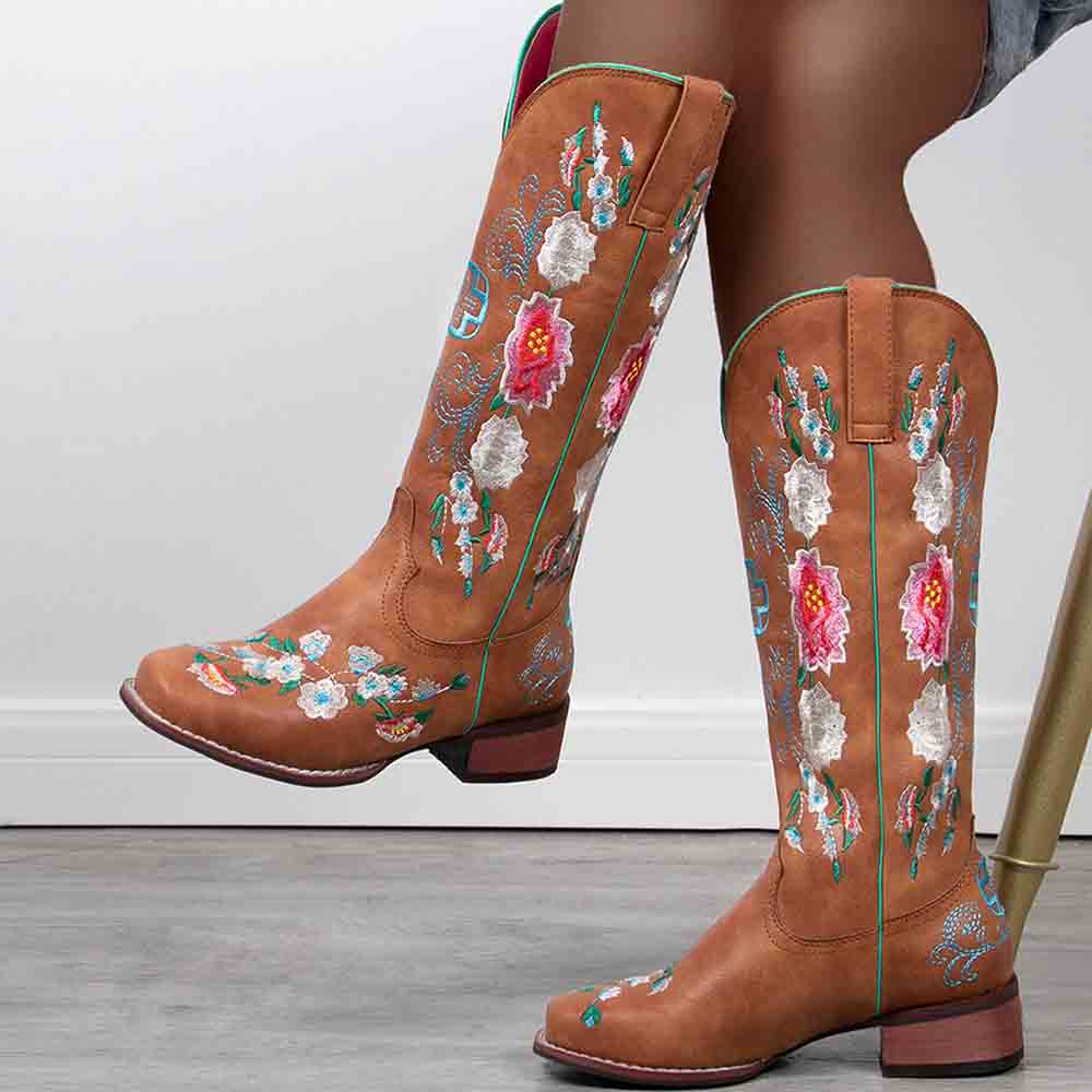 Stylish women's embroidered cowboy boots featuring colorful floral designs and a modern fit