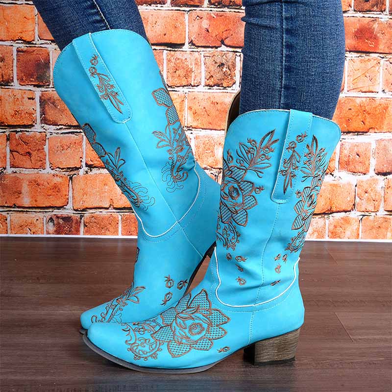 Women's embroidered cowboy boots in blue with intricate floral designs and a stylish heel