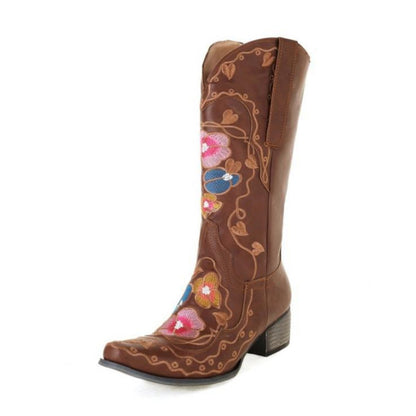 Women's embroidered cowgirl boots in brown with colorful floral designs and a stylish pointed toe