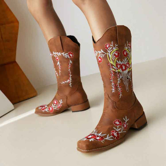 Stylish women's embroidered cowgirl boots with floral designs in brown suede finish