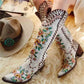 Stylish women's embroidered western cowboy boots with colorful floral designs and unique stitching