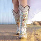 Women's embroidered white western cowboy boots with intricate floral designs and decorative stitching