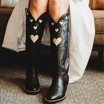 Stylish women's embroidery heart cowgirl boots featuring intricate heart designs and a sleek black finish