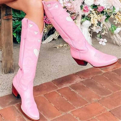 Stylish women's embroidery heart cowgirl boots in pink with decorative heart cutouts