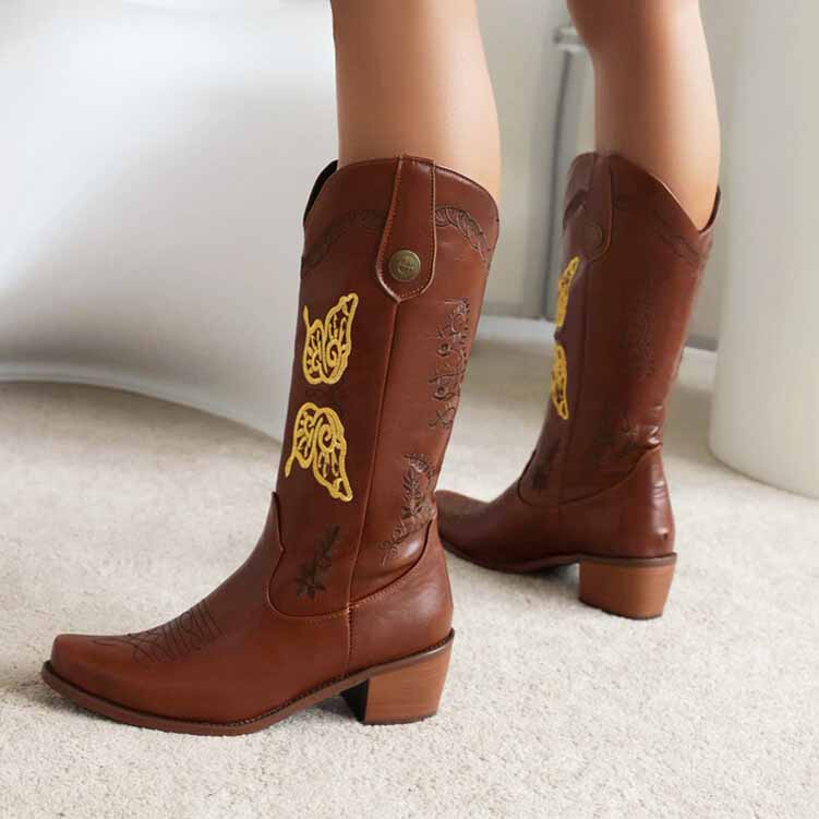 Tucomosi women's floral embroidery cowgirl boots in brown with elegant yellow accents and a stylish heel
