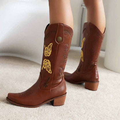 Tucomosi women's floral embroidery cowgirl boots in brown with elegant yellow accents and a stylish heel