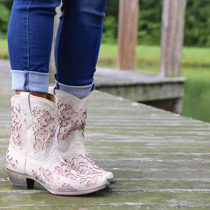 Stylish women's glitter western wedding boots with intricate designs, perfect for a rustic wedding look