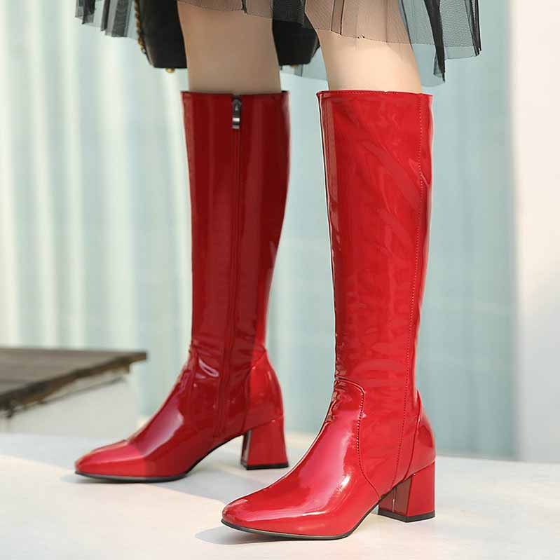 Stylish red women's knee high boots with a chunky heel and sleek design for fashionable looks