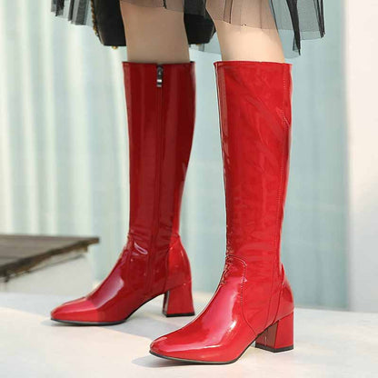 Stylish red women's knee high boots with a chunky heel and sleek design for fashionable looks