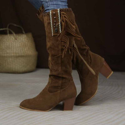 Stylish women's knee high cowgirl boots with fringe detail and block heels for a trendy look