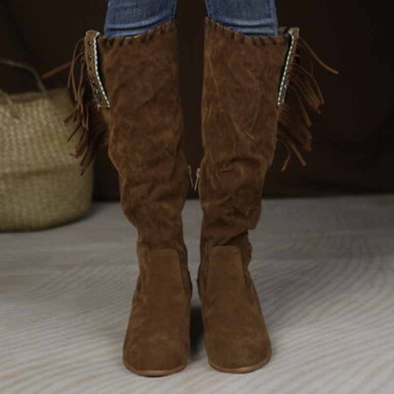 Stylish women's knee high cowgirl boots in brown with fringe detailing for a trendy western look