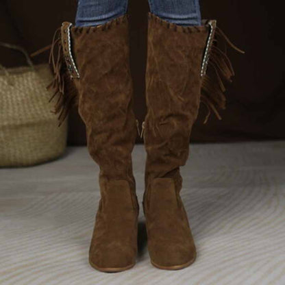Stylish women's knee high cowgirl boots in brown with fringe detailing for a trendy western look