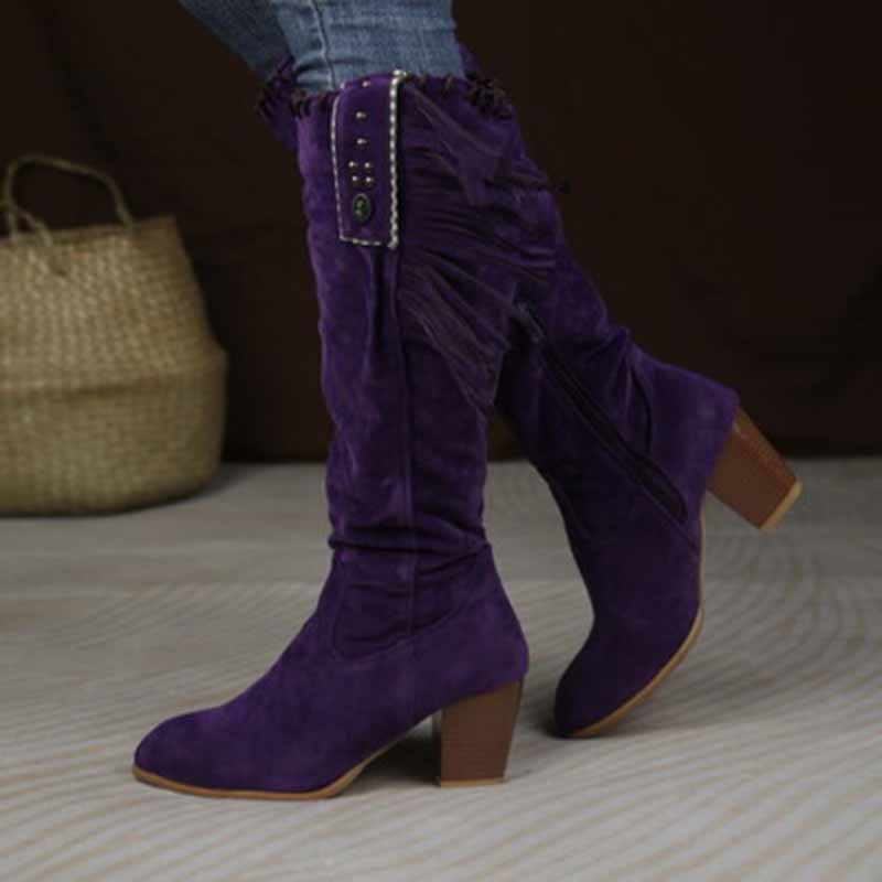Purple women's knee high cowgirl boots with fringe detail and a stylish heel for fashionable looks