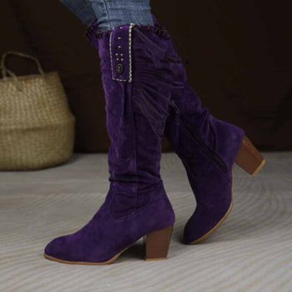 Purple women's knee high cowgirl boots with fringe detail and a stylish heel for fashionable looks