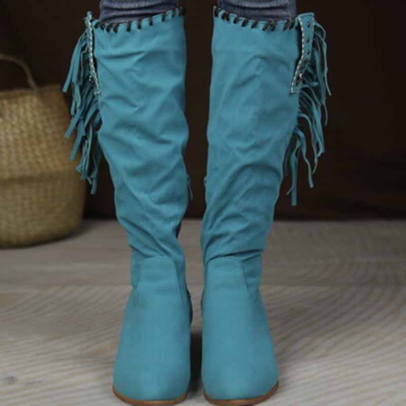 Stylish women's knee high cowgirl boots in teal with decorative fringe details