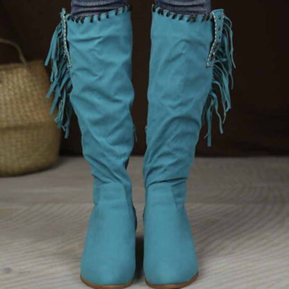 Stylish women's knee high cowgirl boots in teal with decorative fringe details