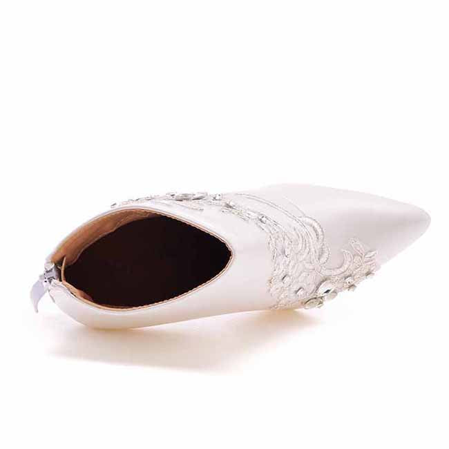 Elegant women's lace wedding boots with intricate embroidery for a stylish bridal look