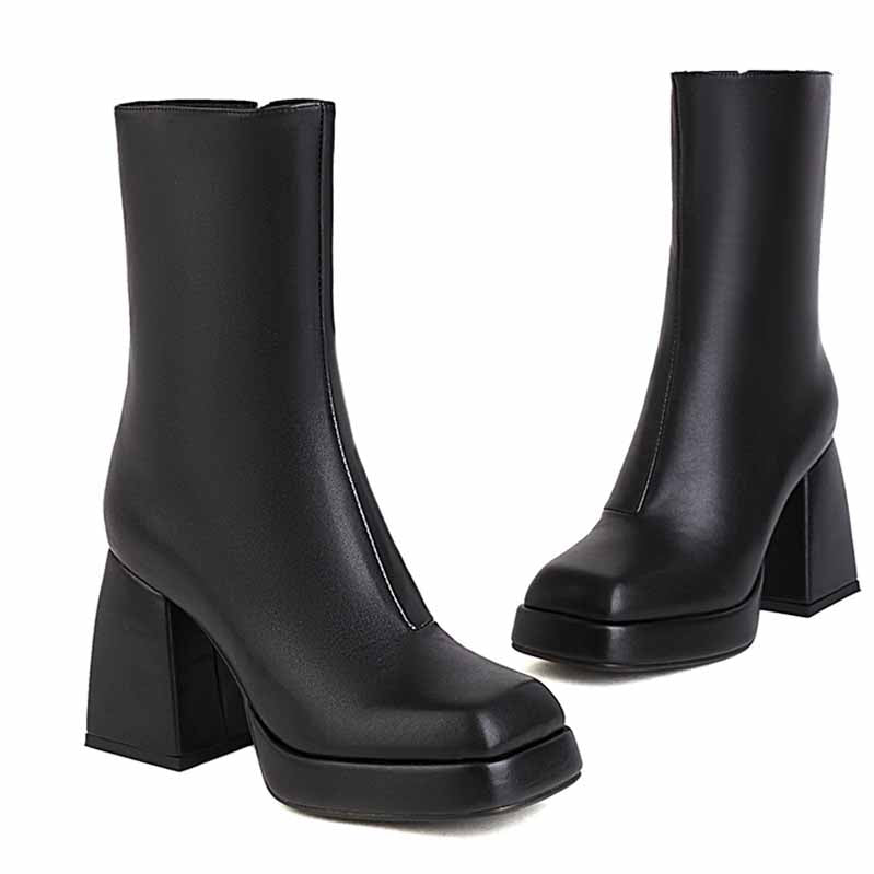 Stylish women's patent leather ankle boots with a chunky heel for a modern look