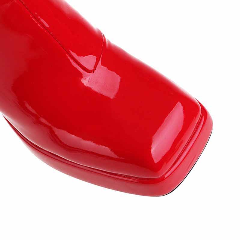 Stylish red women's patent leather ankle boots with a sleek design and pointed toe