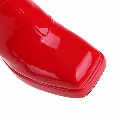 Stylish red women's patent leather ankle boots with a sleek design and pointed toe