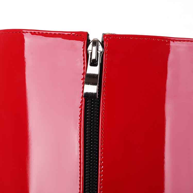 Close-up of S&DCo. women's patent leather knee high boots with a sleek zipper detail