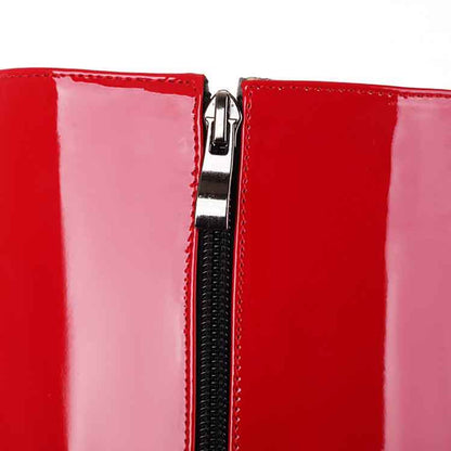 Close-up of S&DCo. women's patent leather knee high boots with a sleek zipper detail