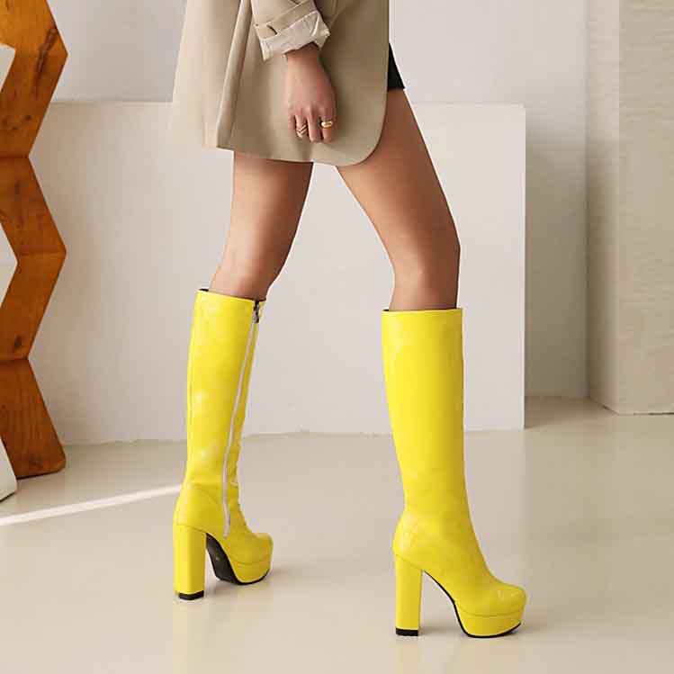 Stylish yellow women's patent leather knee high boots with a high heel for trendy outfits