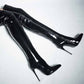 Women's patent leather thigh high boots with sleek design and high stiletto heels