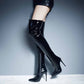 Stylish women's patent leather thigh high boots with a sleek design and high heels