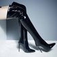 Women's patent leather thigh high boots with sleek design and pointed toes for stylish outfits