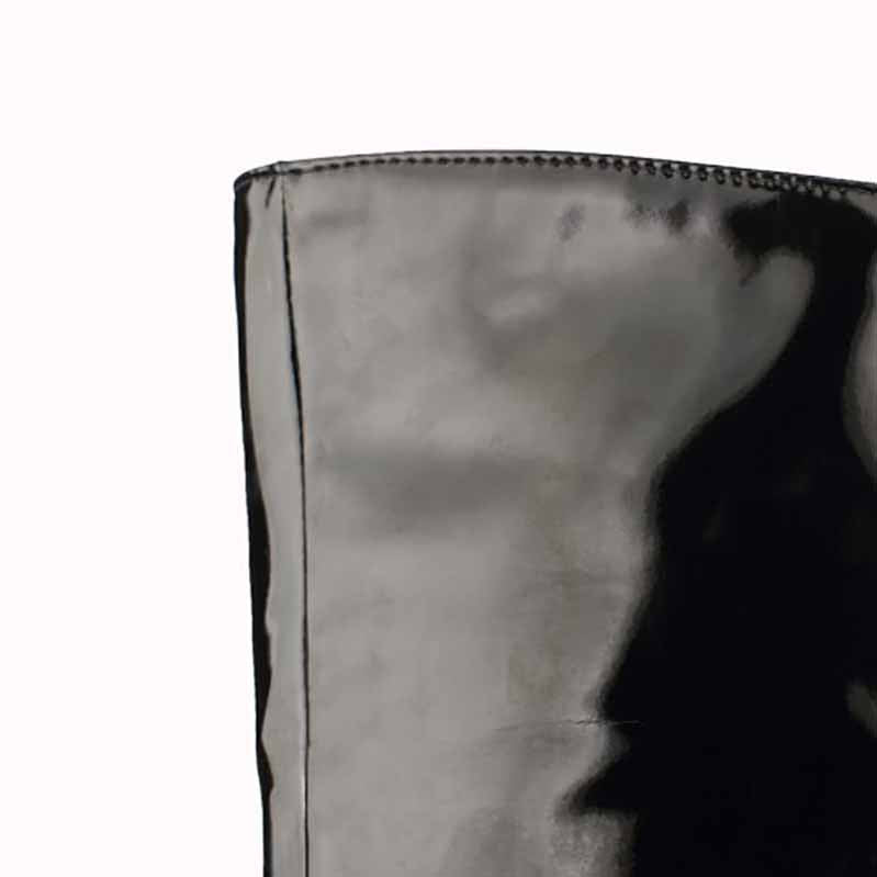 Close-up of women's patent leather thigh high boots showcasing sleek and shiny design