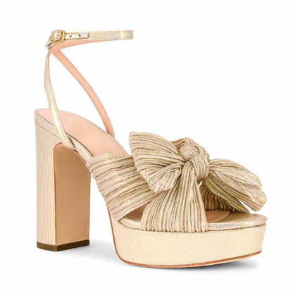 Women's platform bow sandals in gold with a stylish knot design and high block heel