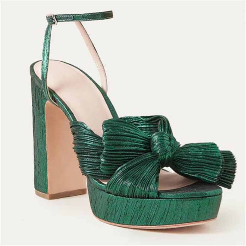 Green women's platform bow sandals with a stylish design and ankle strap perfect for weddings