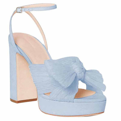 Elegant women's platform bow sandals in light blue for weddings and special occasions