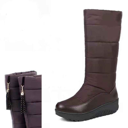 Stylish women's waterproof snow boots with a sleek design and comfortable wedge sole for winter wear