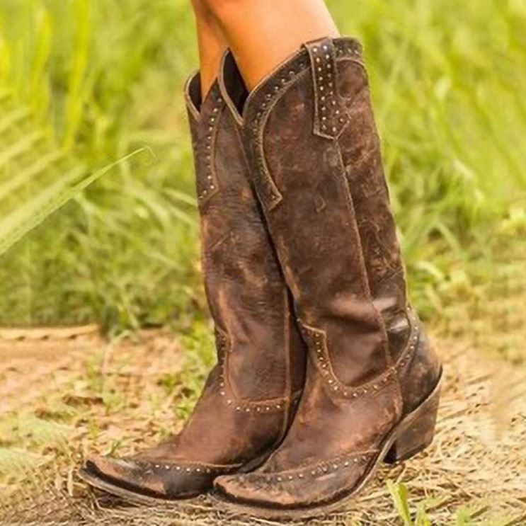 Stylish women's western short wedding boots with decorative studs and a distressed finish