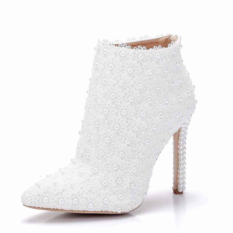 Women's white wedding ankle boots with elegant bead detailing and high stiletto heels