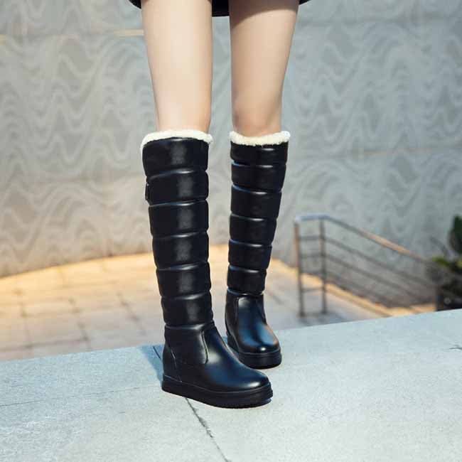 women's winter knee high boots in black with plush lining for warmth and comfort