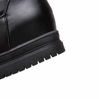 Close-up of women's winter knee high boots with durable rubber sole for cold weather comfort