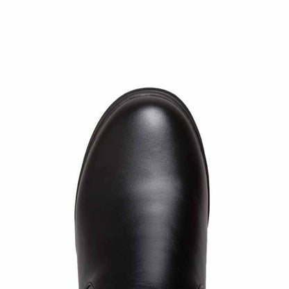 Close-up of women's winter knee high boots in sleek black leather