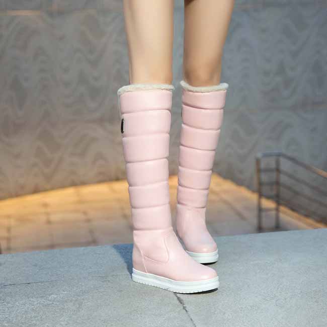 women's winter knee high boots in pink with a plush lining for warmth and comfort